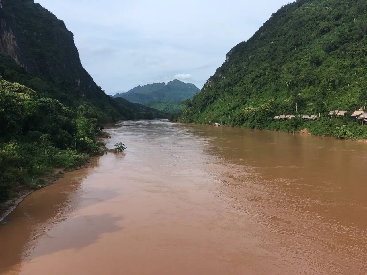 The Nam Ou flowing between steep forested ridges, seen from the bridge at Nong Khiaw